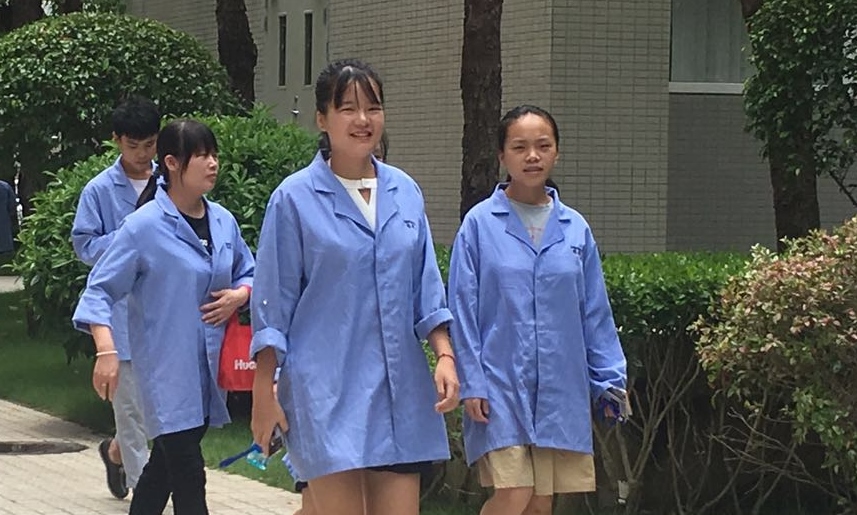 OK 2 female workers smile